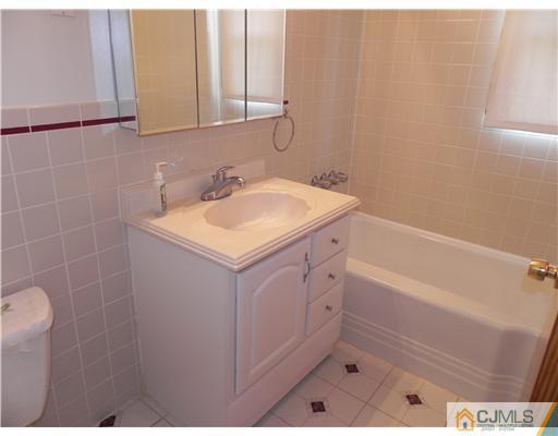 3 Sturgis Road Edison, NJ 08817 - Photo 12 of 17 a bathroom with a sink and a bathtub