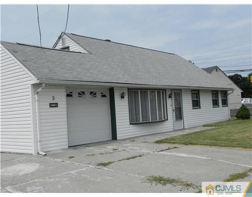 3 Sturgis Road Edison, NJ 08817 - Photo 15 of 17 a front view of a house with a garage