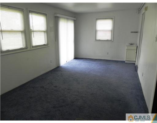 3 Sturgis Road Edison, NJ 08817 - Photo 6 of 17 an empty room with windows