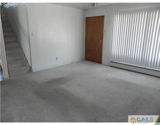 3 Sturgis Road Edison, NJ 08817 - Photo 9 of 17 a view of a livingroom with an empty space
