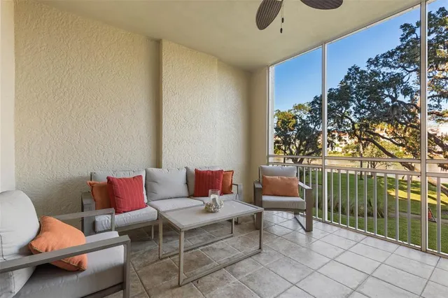 a view of a chairs and table in the balcony