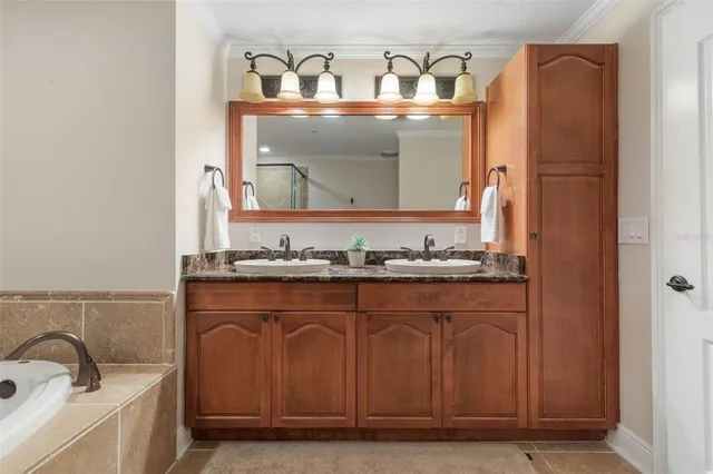 a view of a kitchen with wooden floor and electronic appliances