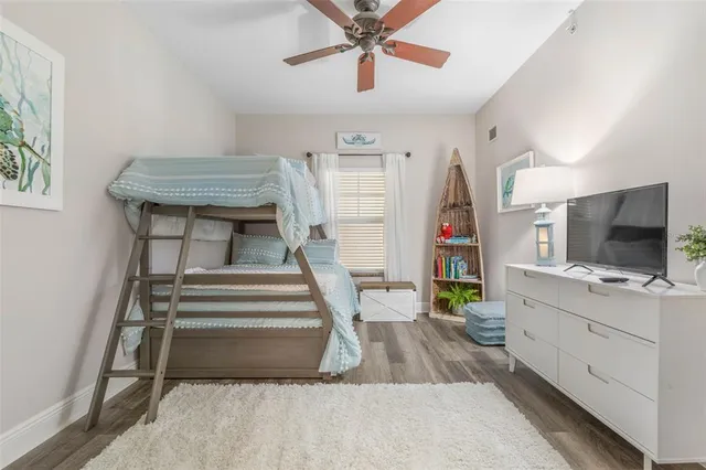 a bedroom with a bed and a lamp