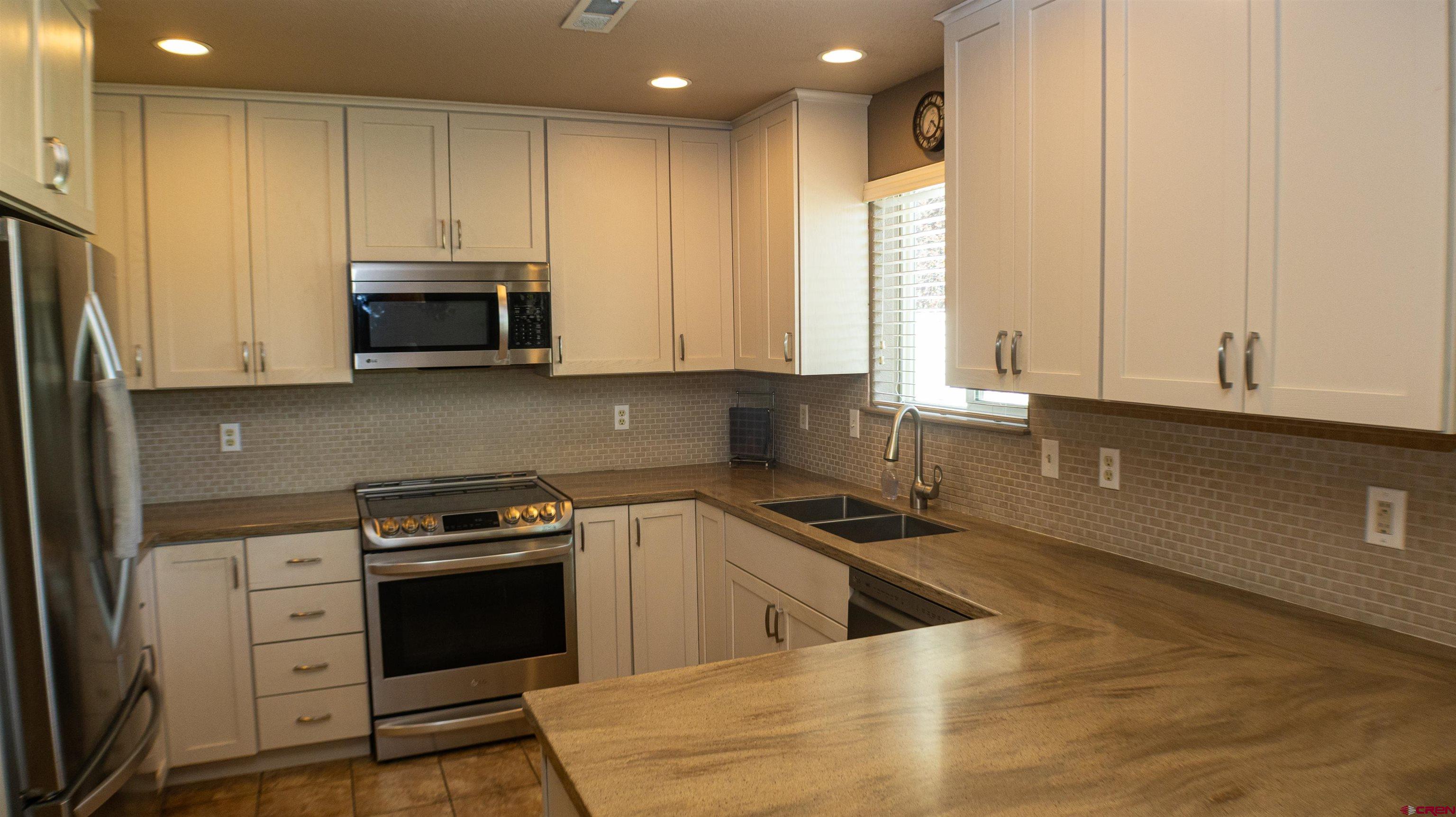 568 20th Street Delta, CO 81416 - Photo 5 of 26 Fieldstone soft close cabinets