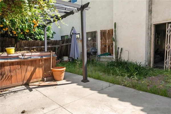 a view of a backyard with sitting area