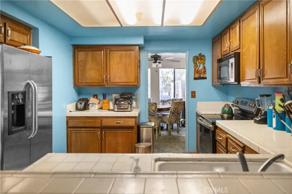 a kitchen with a refrigerator and a sink