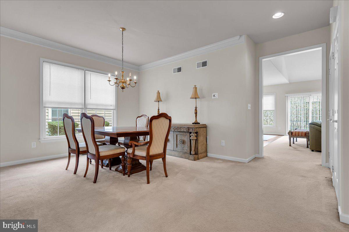 237 Crescent Road Landenberg, PA 19350 - Photo 13 of 46 a view of a dining room with furniture and chandelier