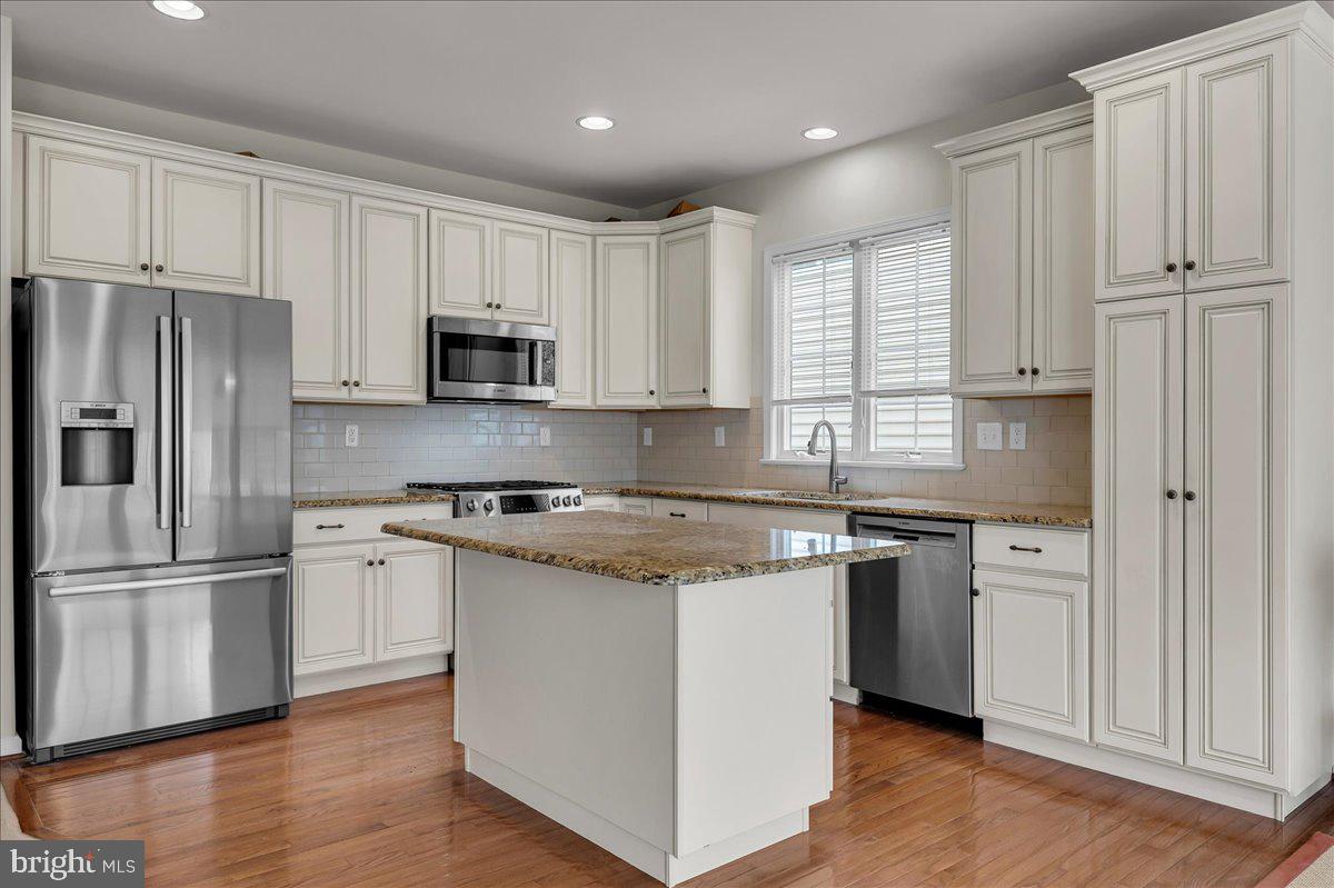 237 Crescent Road Landenberg, PA 19350 - Photo 22 of 46 a kitchen with granite countertop white cabinets and stainless steel appliances