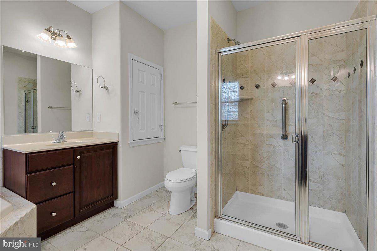 237 Crescent Road Landenberg, PA 19350 - Photo 29 of 46 a bathroom with a double vanity sink toilet and shower