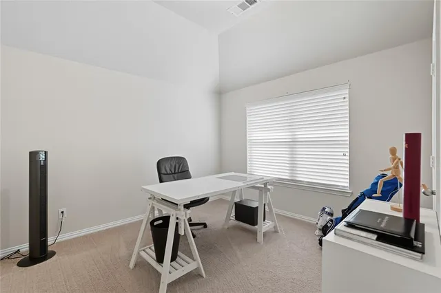 a view of hallway with windows