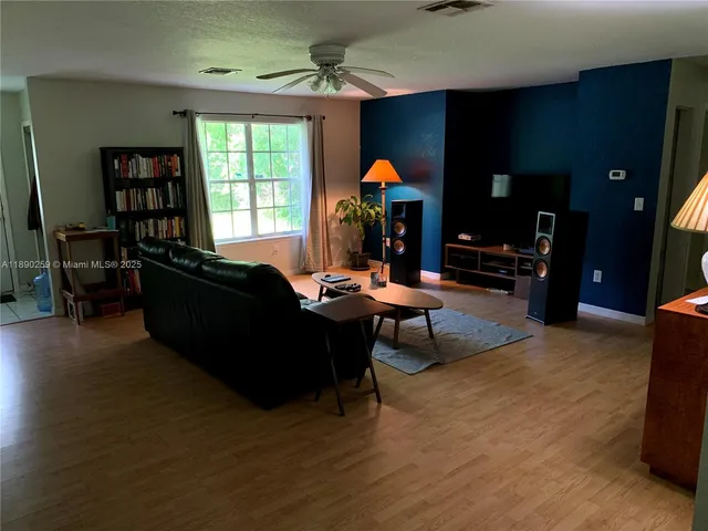 a living room with furniture and a window