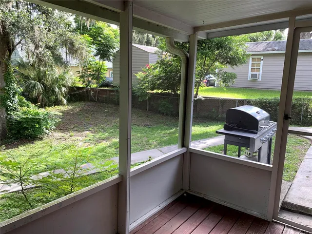 a view of a chairs and table on the wooden floor