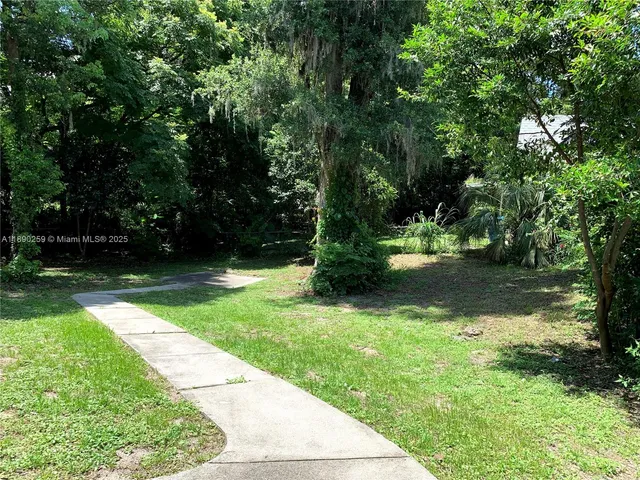 a view of backyard with green space