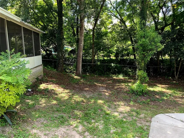 a backyard of a house with lots of green space