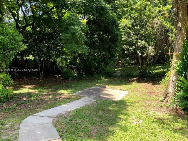 a backyard of a house with lots of green space