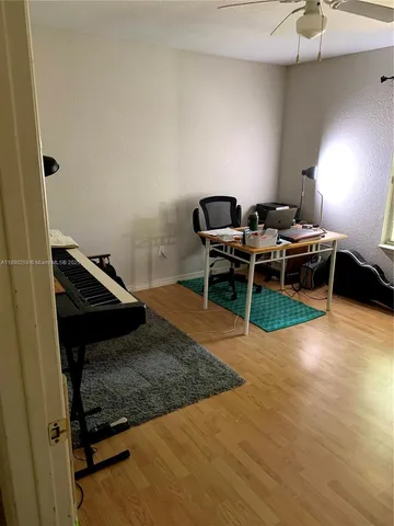 a living room with a rug