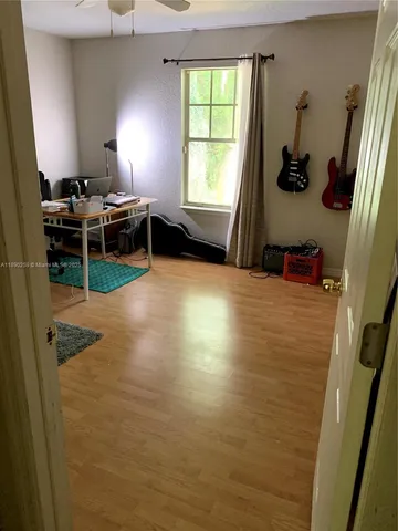 a view of kitchen and empty room
