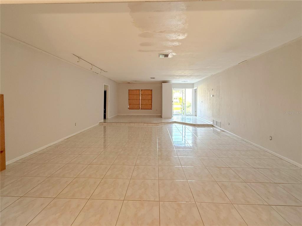 2464 Derbyshire Road Maitland, FL 32751 - Photo 11 of 42 a view of an empty room with a window