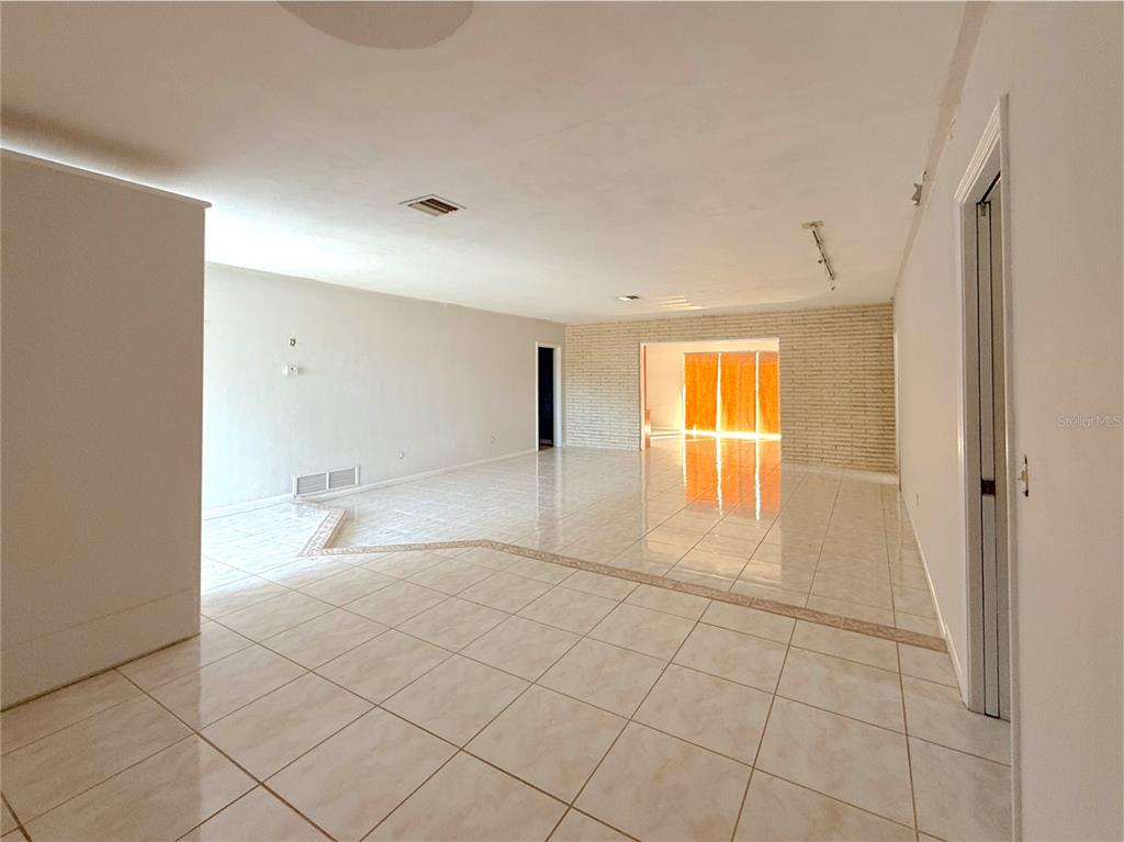 2464 Derbyshire Road Maitland, FL 32751 - Photo 12 of 42 a view of an empty room and window