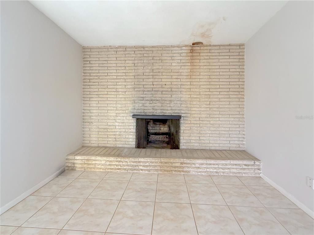 2464 Derbyshire Road Maitland, FL 32751 - Photo 15 of 42 a view of wooden floor with a fireplace
