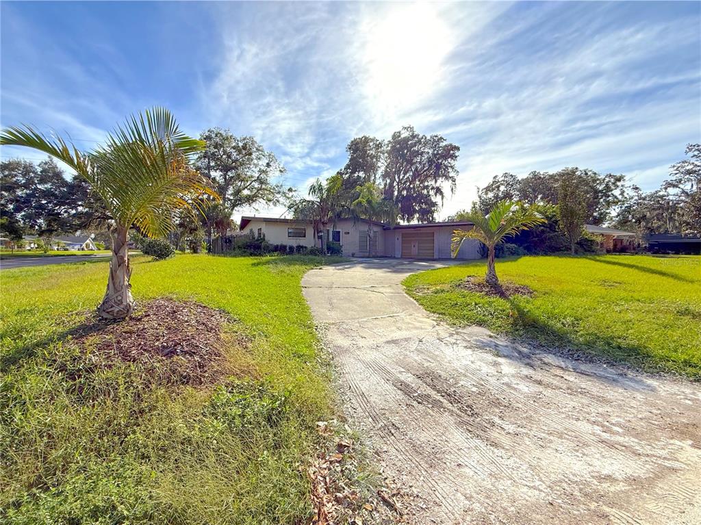 2464 Derbyshire Road Maitland, FL 32751 - Photo 2 of 42 a view of a swimming pool with an outdoor space and seating area