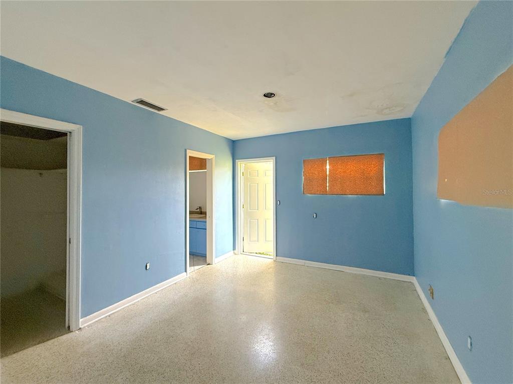 2464 Derbyshire Road Maitland, FL 32751 - Photo 21 of 42 a view of an empty room with a window
