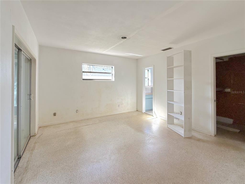 2464 Derbyshire Road Maitland, FL 32751 - Photo 22 of 42 a view of an empty room with a window