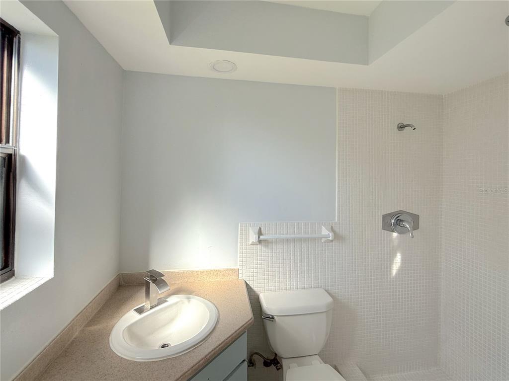 2464 Derbyshire Road Maitland, FL 32751 - Photo 27 of 42 a bathroom with a sink and a mirror