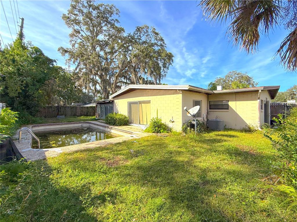 2464 Derbyshire Road Maitland, FL 32751 - Photo 30 of 42 a view of a house with a swimming pool