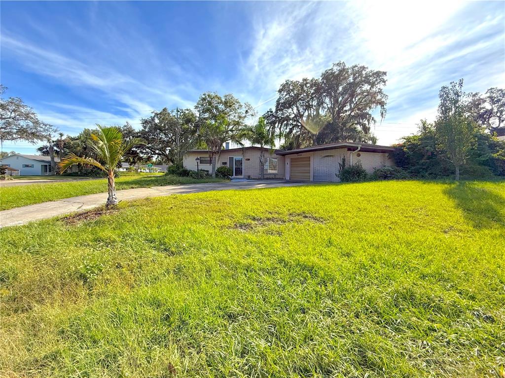 2464 Derbyshire Road Maitland, FL 32751 - Photo 4 of 42 a view of a swimming pool with an outdoor space and seating area