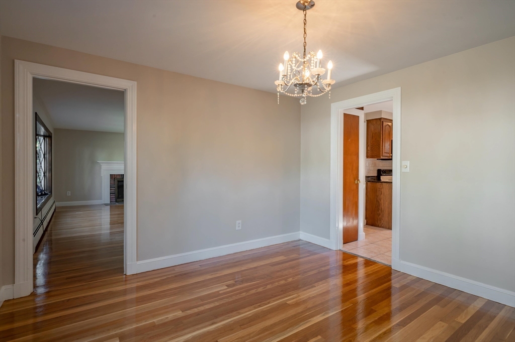41 Marcus Road Wilmington, MA 01887 - Photo 11 of 29 a view of livingroom with chandelier and wooden floor