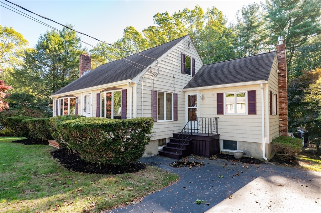41 Marcus Road Wilmington, MA 01887 - Photo 2 of 29 a view of a house with a yard chairs and floor to ceiling window