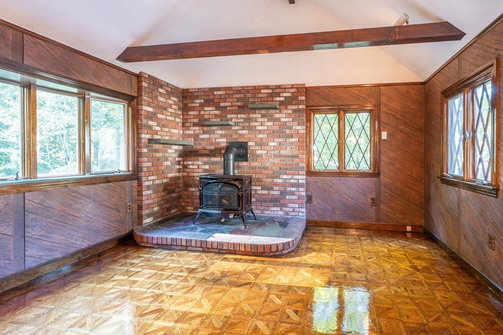 41 Marcus Road Wilmington, MA 01887 - Photo 9 of 29 a view of an empty room with a fireplace and a window