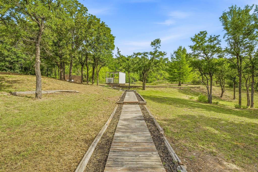 151 High Point Road Weatherford, TX 76088 - Photo 28 of 40 a view of an outdoor space with swimming pool