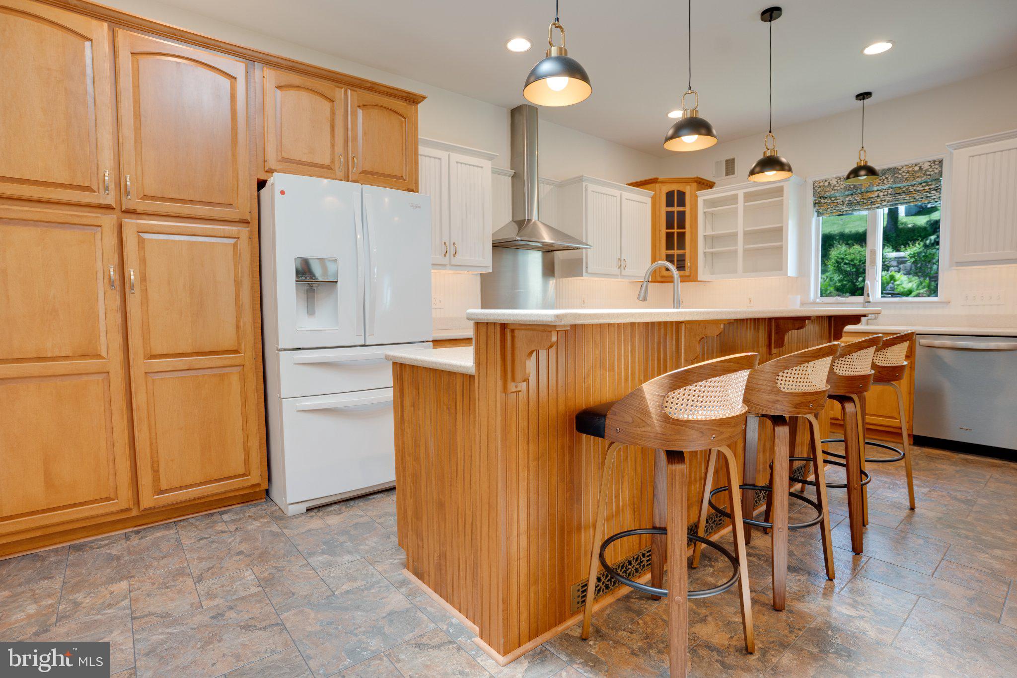 149 Walnut Street Reedsville, PA 17084 - Photo 22 of 83 Warm wood tones in a bright kitchen.