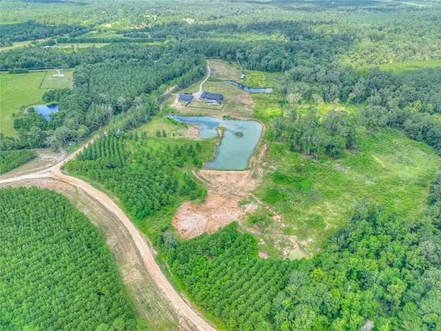 a view of a garden with a building