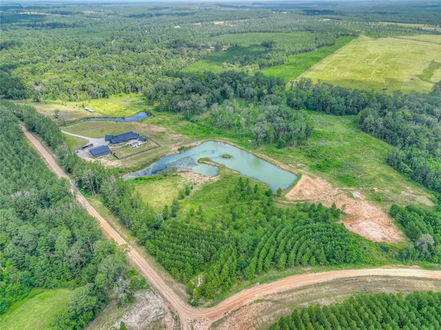 a view of a yard with an outdoor seating