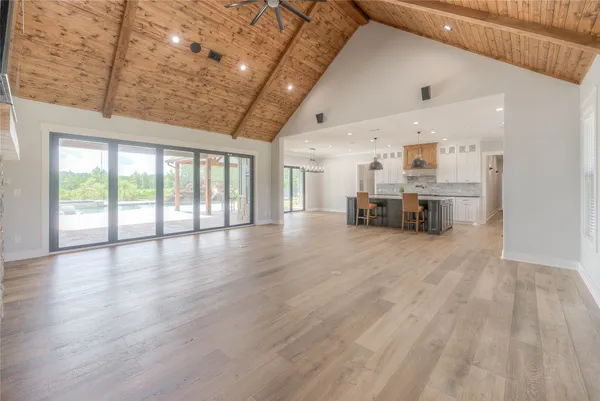 a view of kitchen with furniture and wooden floor