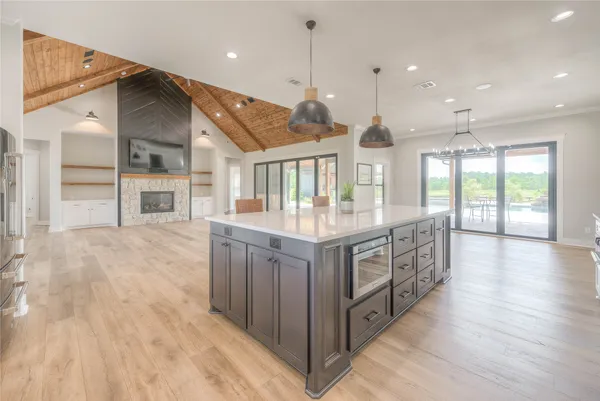 a kitchen with stainless steel appliances granite countertop a stove and a sink