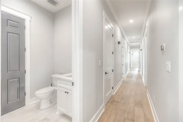 a bathroom with a toilet sink and a shower