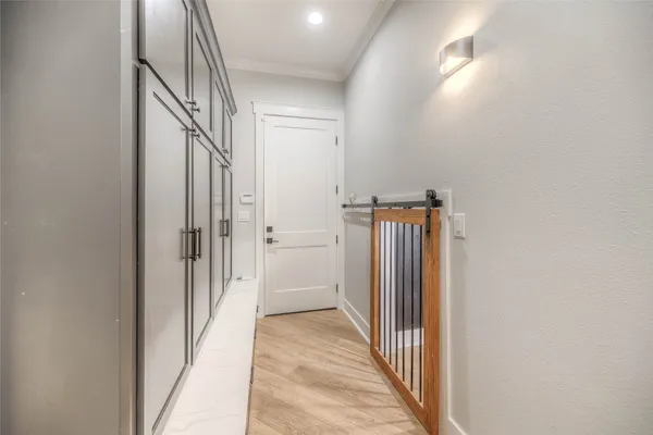 a view of a hallway with a dining area