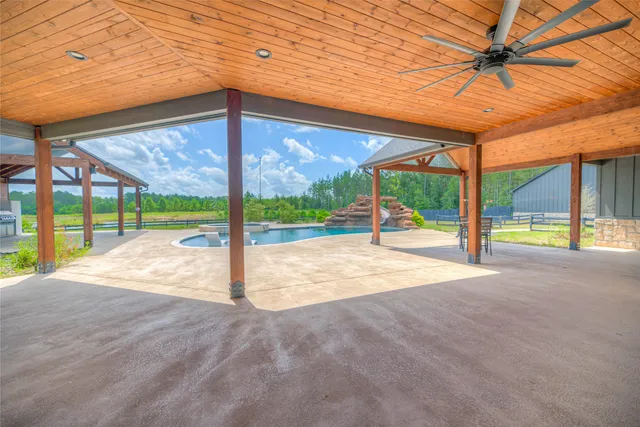 a view of an empty room with a floor to ceiling window