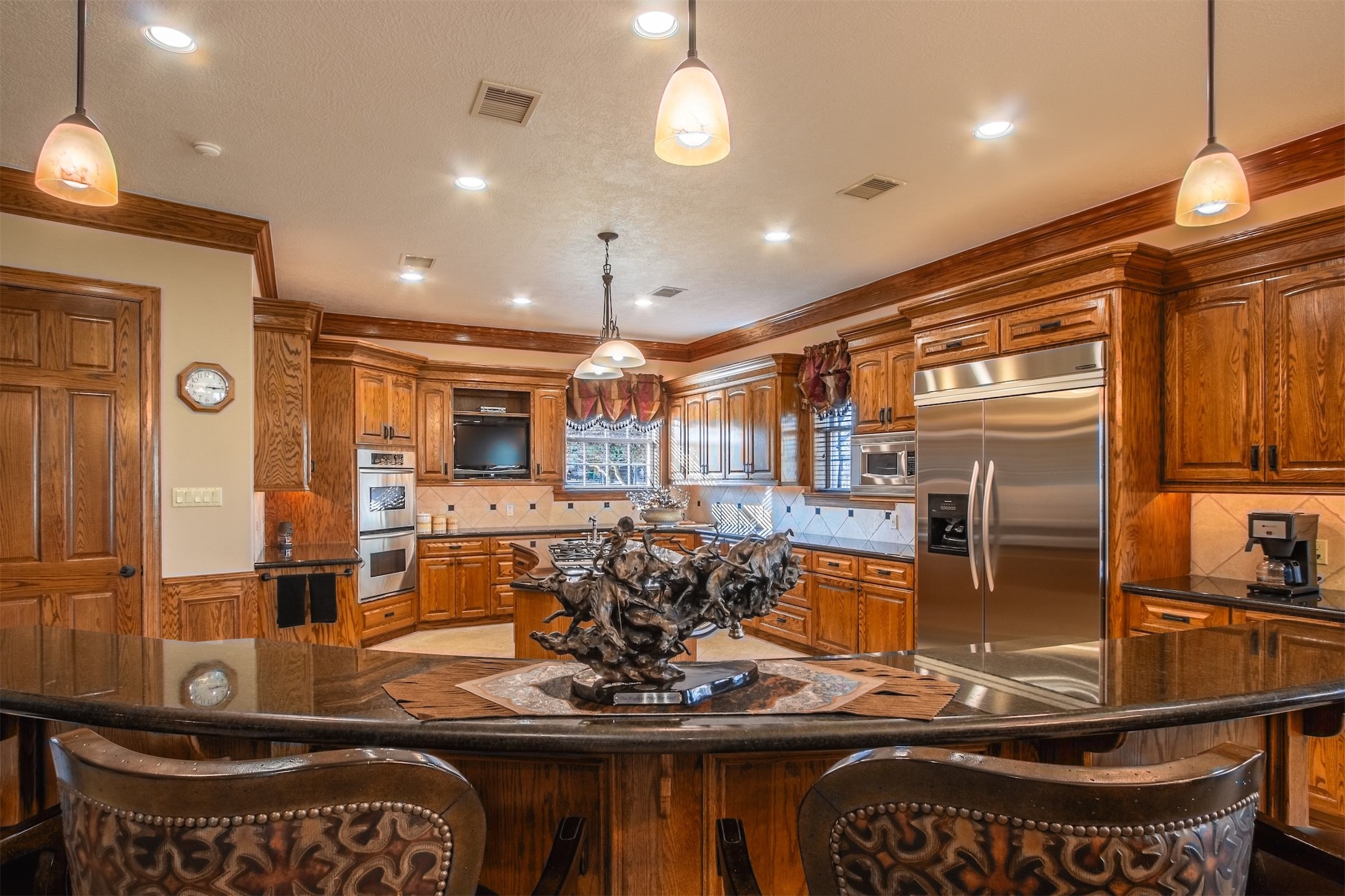 3150 Holmes Road Richmond, TX 77406 - Photo 16 of 28 a kitchen with stainless steel appliances granite countertop a stove a refrigerator and a sink
