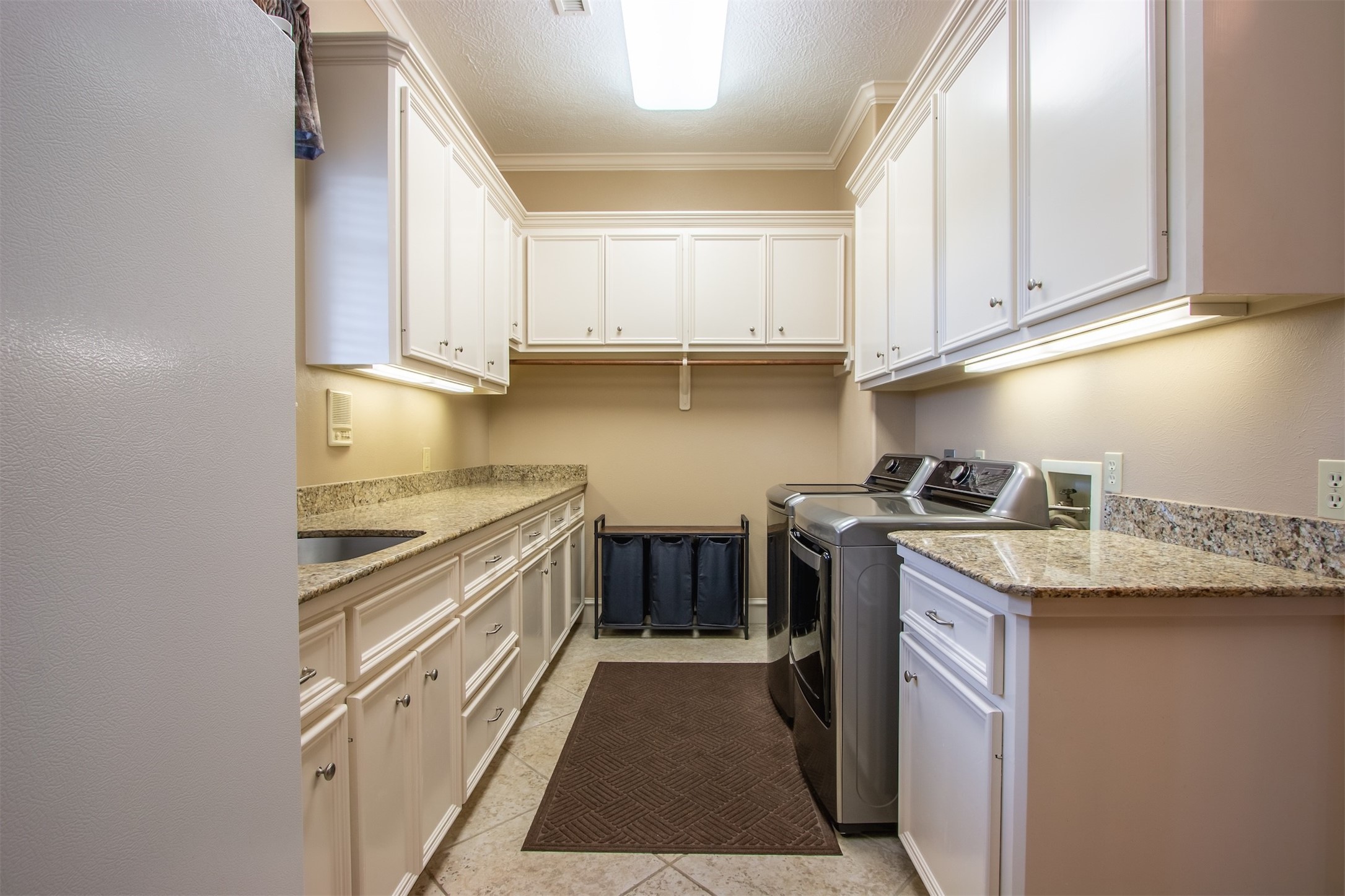 3150 Holmes Road Richmond, TX 77406 - Photo 22 of 28 a kitchen with stainless steel appliances granite countertop a stove and a sink