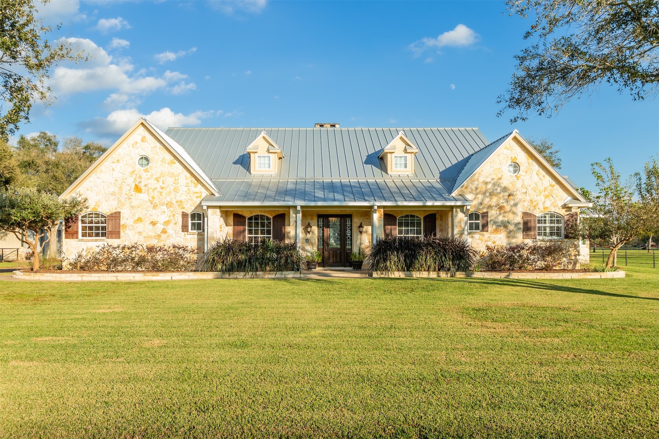 3150 Holmes Road Richmond, TX 77406 - Photo 4 of 28 a front view of house with yard and outdoor seating