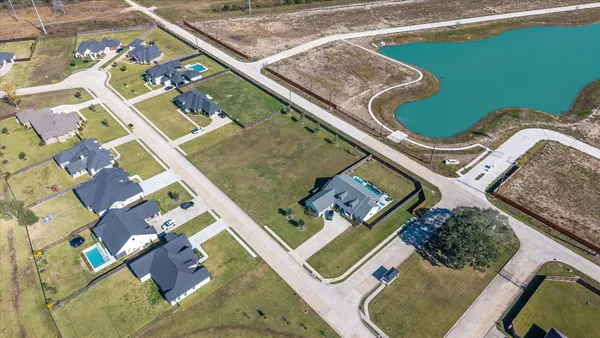 an aerial view of a swimming pool and outdoor space