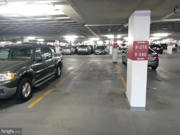 a view of parking garage with cars