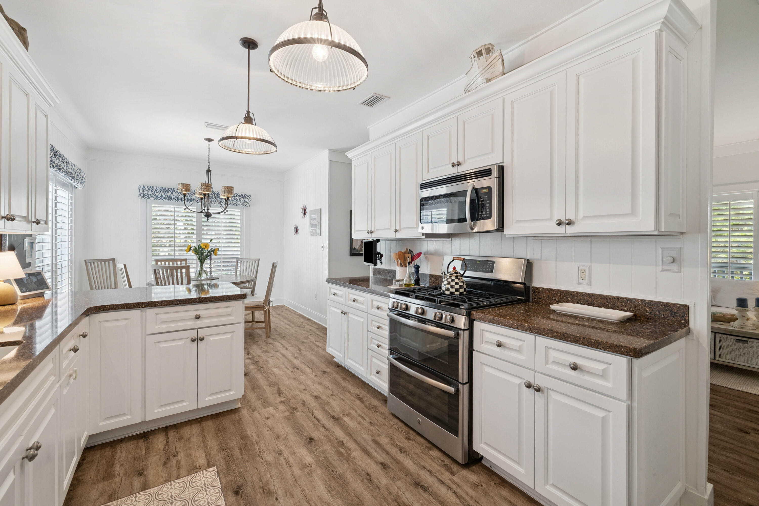 298 Cullman Avenue Santa Rosa Beach, FL 32459 - Photo 17 of 63 a kitchen with stainless steel appliances granite countertop a sink and stove top oven
