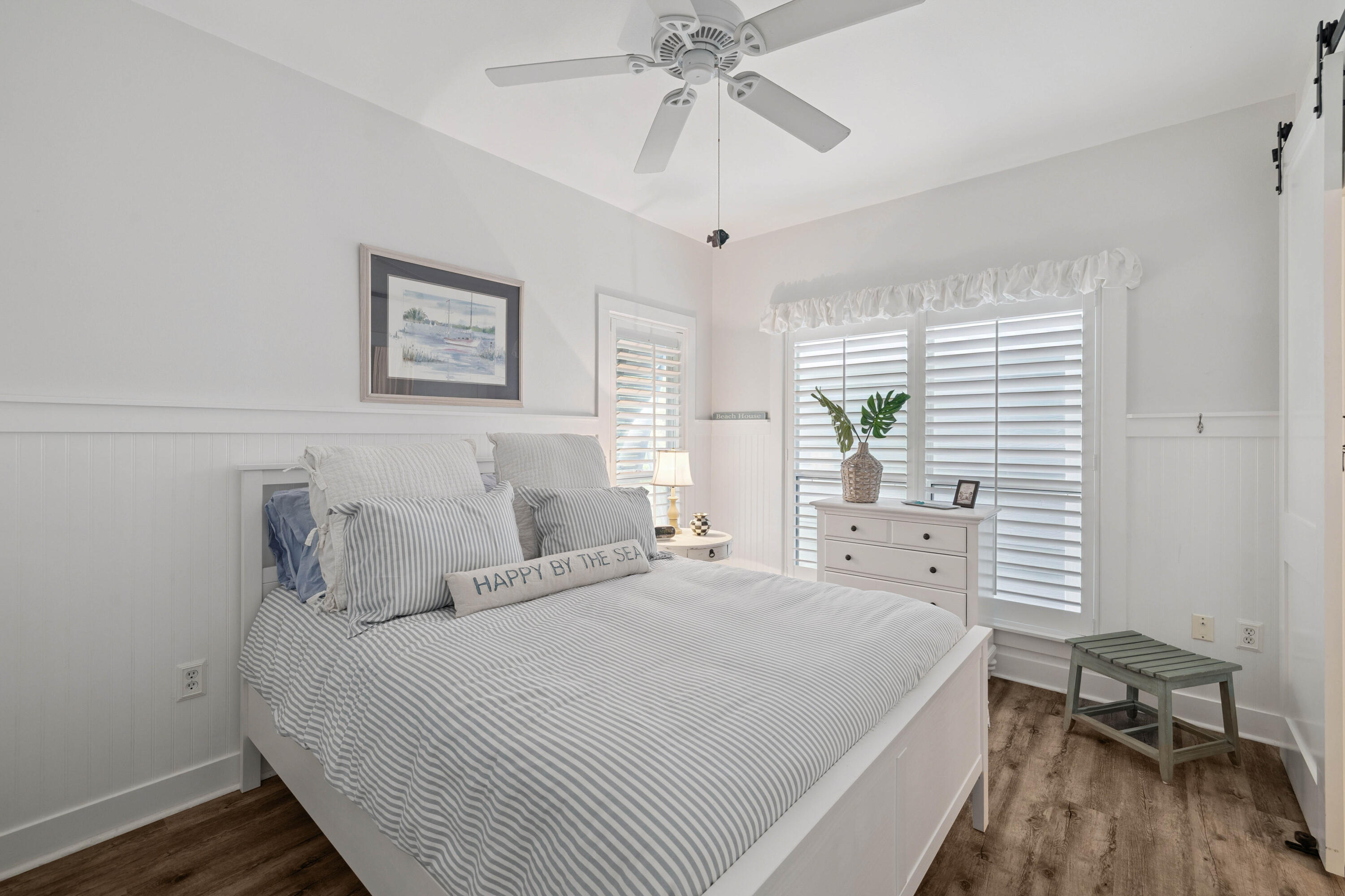 298 Cullman Avenue Santa Rosa Beach, FL 32459 - Photo 18 of 63 a bedroom with a bed and a chandelier