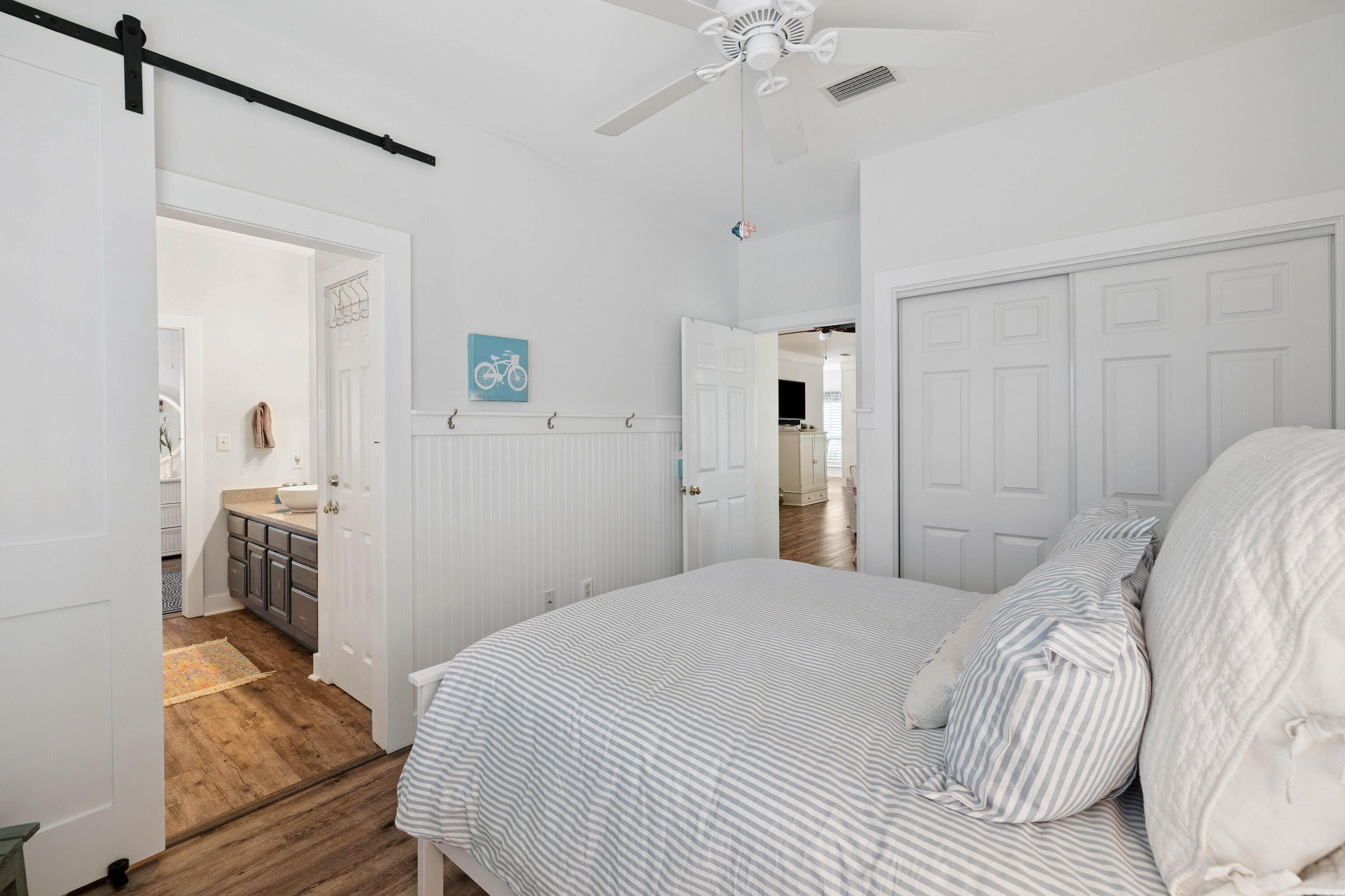 298 Cullman Avenue Santa Rosa Beach, FL 32459 - Photo 19 of 63 a bedroom with a bed and a chandelier